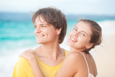 young happy couple having fun on tropical beach  honeymoonの写真素材