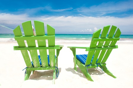 Colorful chairs on Mexican beach of Tulumの写真素材