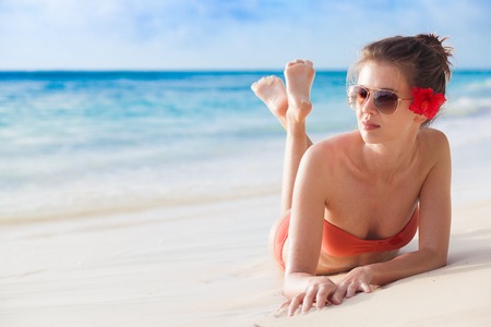 portrait of pretty woman relaxing at tropical beachの写真素材