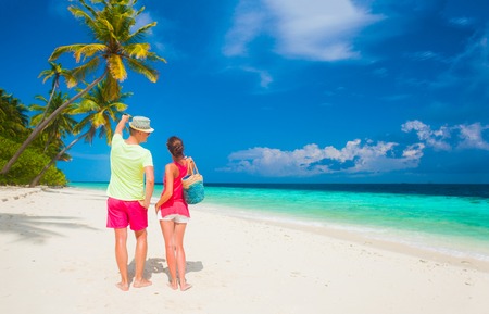 happy young couple having fun by the beachの写真素材