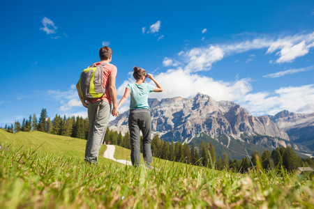 Travelers hiking in breathtaking landscape of Dolomites Mounatins in summer in ALta Badia, Italy. Travel Lifestyle wanderlust adventure concept. Outdoor wilderness vacations.の写真素材