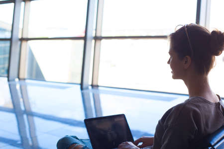 portait of young business woman working on laptopの写真素材
