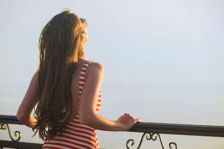 Happy vacation woman on beach summer holiday in cheerful bliss enjoying the sunshine. Beautiful girlの写真素材
