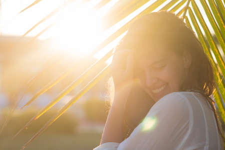 Happy vacation woman on beach summer holiday in cheerful bliss enjoying the sunshine. Beautiful girlの写真素材