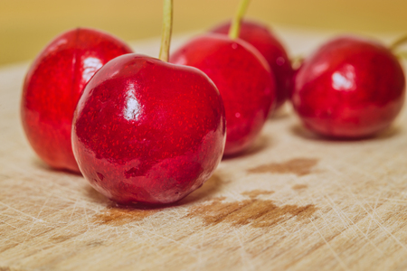 Sweet cherry on a wooden surfaceの写真素材