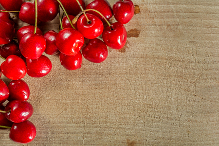 Sweet cherry on a wooden surfaceの写真素材