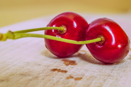Sweet cherry on a wooden surfaceの写真素材