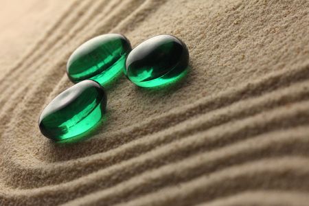 green stones on a sand の写真素材