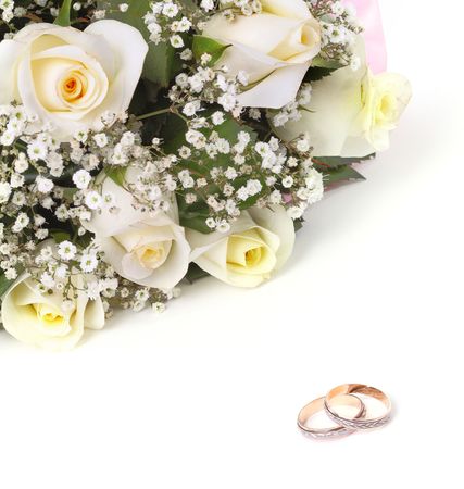 wedding rings and roses bouquet の写真素材