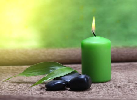 candle light, leaf and stones の写真素材