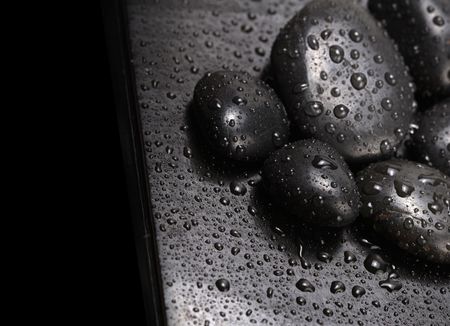 black stones with water drops の写真素材