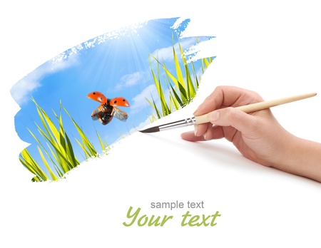 hand with brush and paintの写真素材