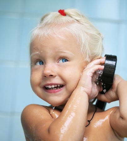 little baby child girl in bathの写真素材
