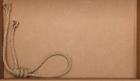 Rope on cardboard texture backgroundの写真素材