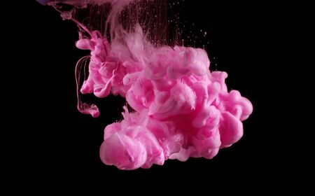 Acrylic pink colors in water. Ink blot. Abstract background.の写真素材