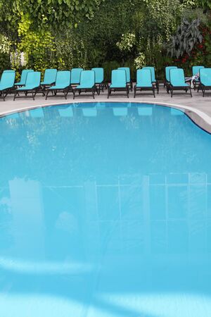 Spa area with blue swimming pool の写真素材