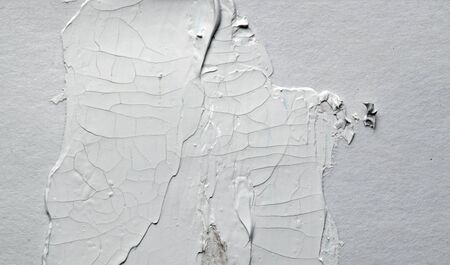 White smear brush stroke on gray empty wall. Abstract background.の写真素材