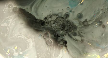 Macro Abstract texture background. Acrylic color in water and oil.の写真素材