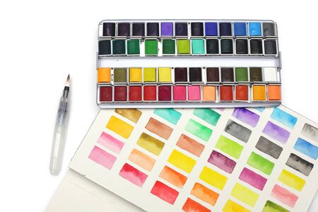 Box with watercolors, brush and palette on a light gray background.
の写真素材