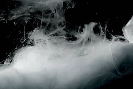 Abstract black and white smoke background. Acrylic colors in water. Ink blot.の写真素材