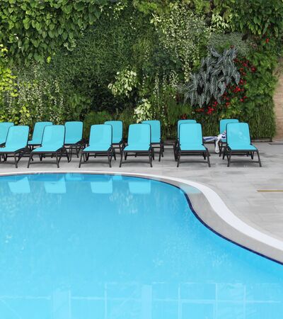 Spa area with blue swimming pool の写真素材