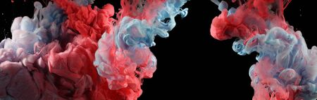 Acrylic blue and red colors in water. Ink blot. Abstract black background. Horizontal long poster, greeting cards, web site, banner, invitation.の写真素材