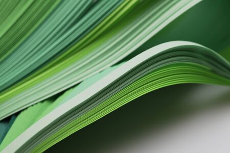 Abstract gradient green color wave curl strip paper background. Template for prints, posters, cards.の写真素材