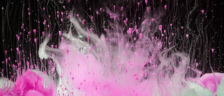 Acrylic pink colors in water. Ink blot.の写真素材