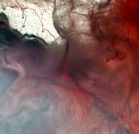 Acrylic colors in water. Ink blot. Abstract smoke background.の写真素材