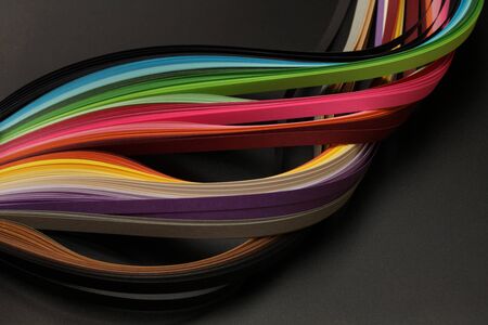 Rainbow color strip wave paper. Abstract texture black background.の写真素材