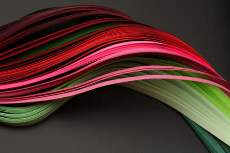 Red and green color strip wave paper. Abstract texture black horizontal background.の写真素材
