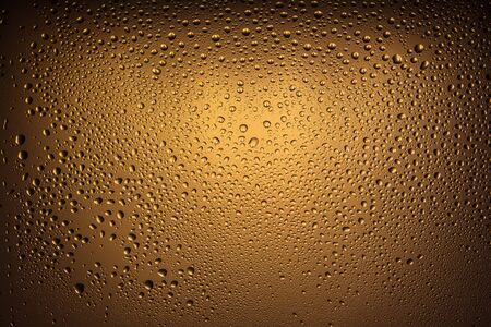 texture of large and small drops of water on a matte surface with color shades