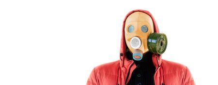 man in a gas mask and a hood on a white backgroundの写真素材