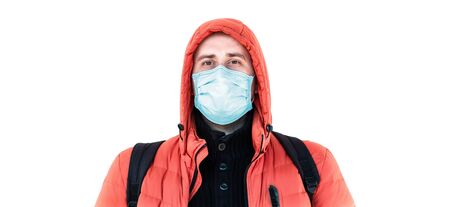 man in a medical mask and a hood on a white backgroundの写真素材