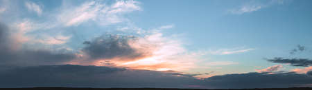 Colorful cloudy sky at sunset. Gradient color. Sky texture, abstract nature backgroundの写真素材
