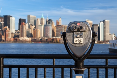 Coin operated binoculars. Coin operated binoculars with New York skyline in the background.の写真素材