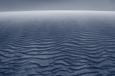 Sand dune. Close up image of wave patterns in sand dune after sunset.