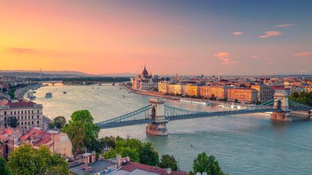 Panoramic aerial cityscape image of Budapest panorama with Szechenyi Chain Bridge and parliament building during summer sunset.の写真素材