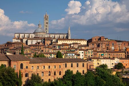 Siena. Aerial cityscape image of medieval city of Siena, Italy during sunny day.