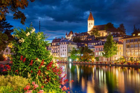 Thun, Switzerland. Cityscape image of beautiful city of Thun with the reflection of the city in the...