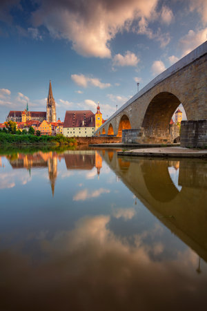 Regensburg, Germany. Cityscape image of Regensburg, Germany with Old Stone Bridge over Danube River and St. Peter Cathedral at summer sunset.の写真素材