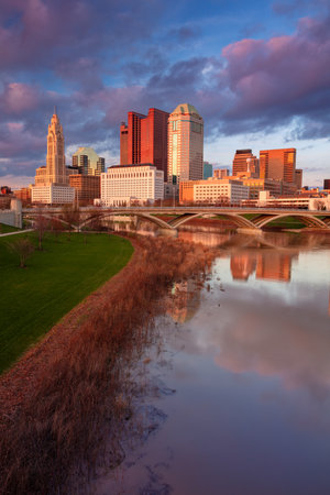 Columbus, Ohio, USA. Cityscape image of Columbus, Ohio, USA downtown skyline with the reflection of the city in the Scioto River at spring sunset.の写真素材