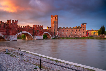 Verona, Italy. Cityscape image of beautiful Italian town Verona with the Castelvecchio Bridge over Adige River at sunrise.の写真素材