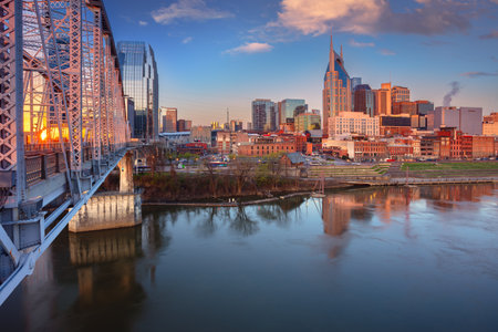 Nashville, Tennessee, USA. Cityscape image of Nashville, Tennessee, USA downtown skyline with reflection of the city the Cumberland River at spring sunrise.の写真素材