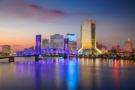 Jacksonville, Florida, USA. Cityscape image of Jacksonville, Florida with reflection of the city skyline in the water at beautiful sunset.の写真素材