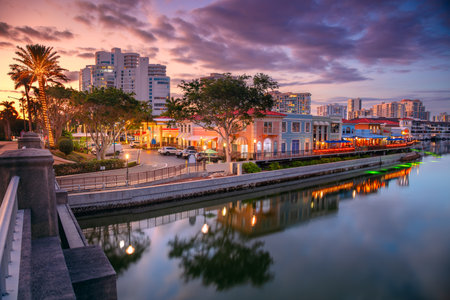 Naples, Florida, USA. Cityscape image of Naples, Florida with reflection of the city skyline in the water at beautiful sunset.の写真素材