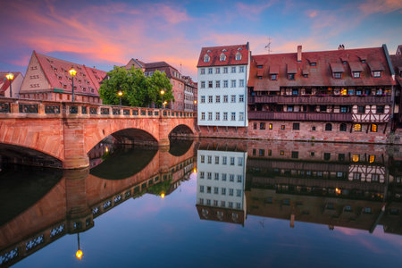 Nuremberg, Germany. Cityscape image of old town Nuremberg, Germany with reflection of the skyline and Max Bridge in Pegnitz River at summer sunset.の写真素材