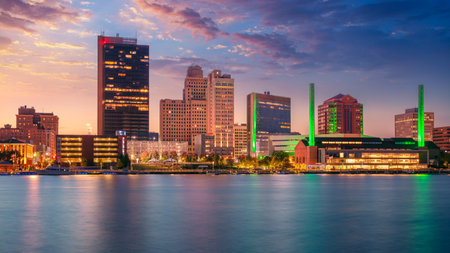 Toledo, Ohio, USA. Cityscape image of downtown Toledo, Ohio with reflection of the skyline in calm Maumee River at beautiful autumn sunset.の写真素材
