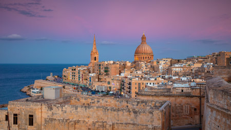 Valletta, Malta. Cityscape image of historical old town of Valletta, Malta with Basilica of Our Lady of Mount Carmel at beautiful autumn sunset.の写真素材