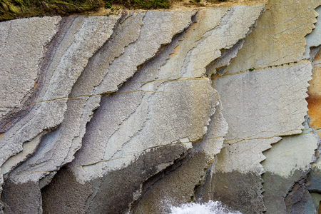 The Acantilado Flysch in Zumaia - Basque Country. Flysch is a sequence of sedimentary rock layers that progress from deep-water and turbidity flow deposits to shallow-water shales and sandstones.の写真素材